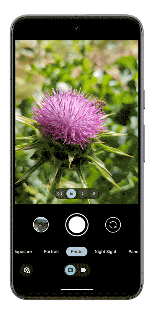 A Pixel 8 showing the new camera interface; the phone’s screen shows the ability to easily switch between photo and video mode.