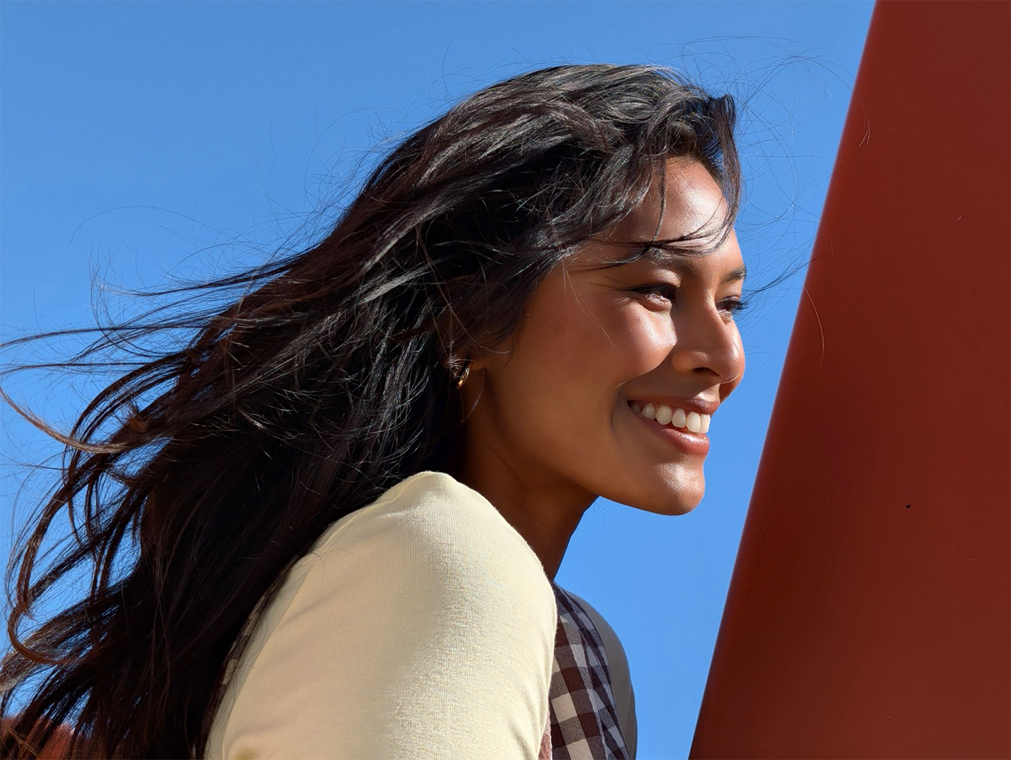 Image showing a woman smiling in sunlight