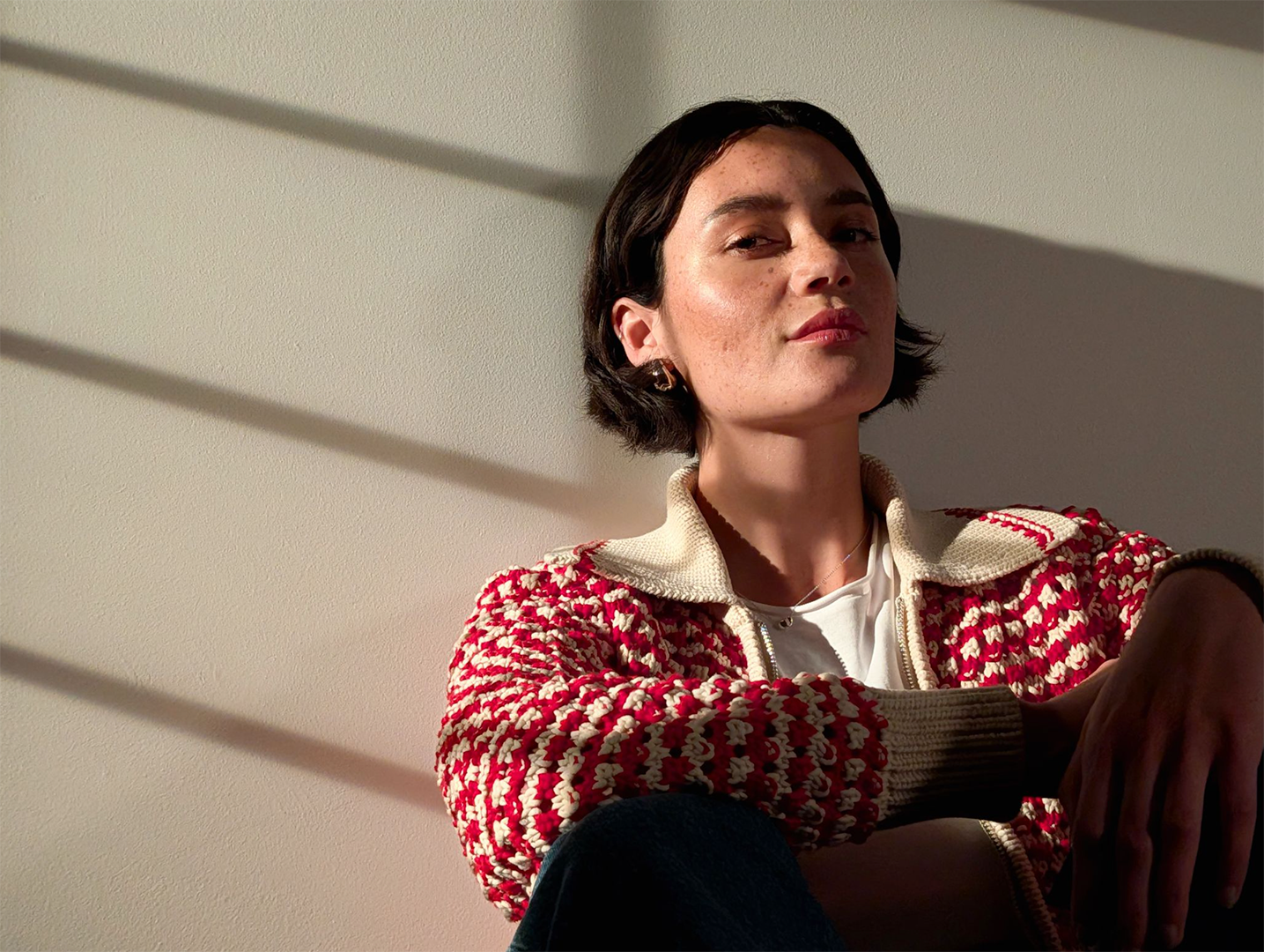 Image showing a woman gazing at camera in shadow light