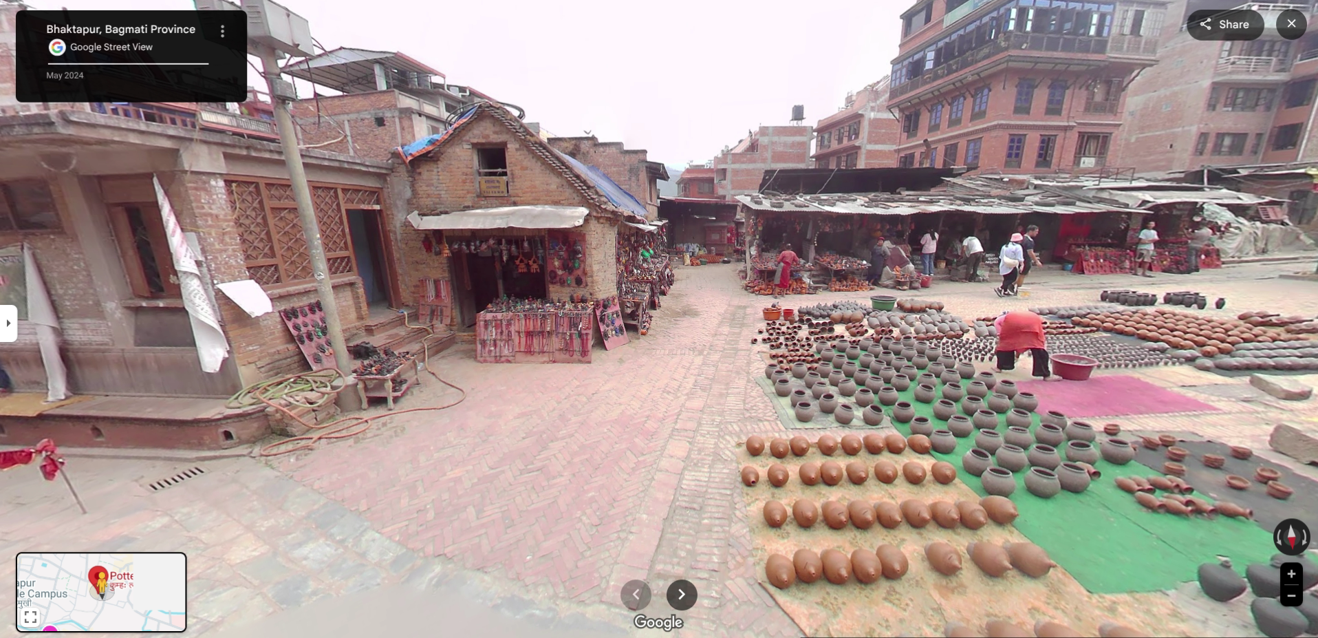 Hundreds of handmade terracotta pots and vessels are arranged neatly on the ground to dry in Bhaktapur's bustling Pottery Square.