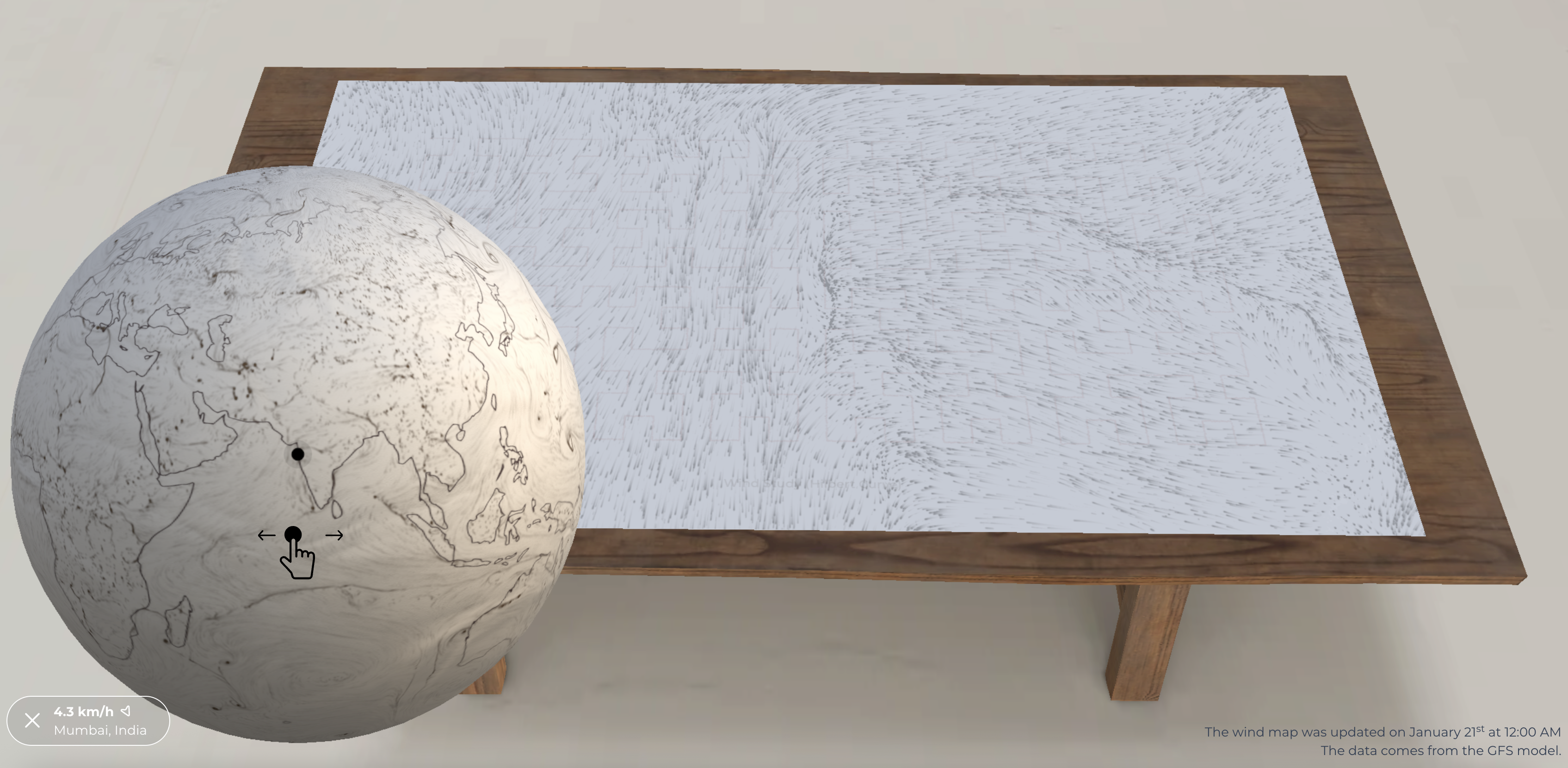 A screenshot of the core experience, a globe sits on the left with the artwork laid on a table behind it