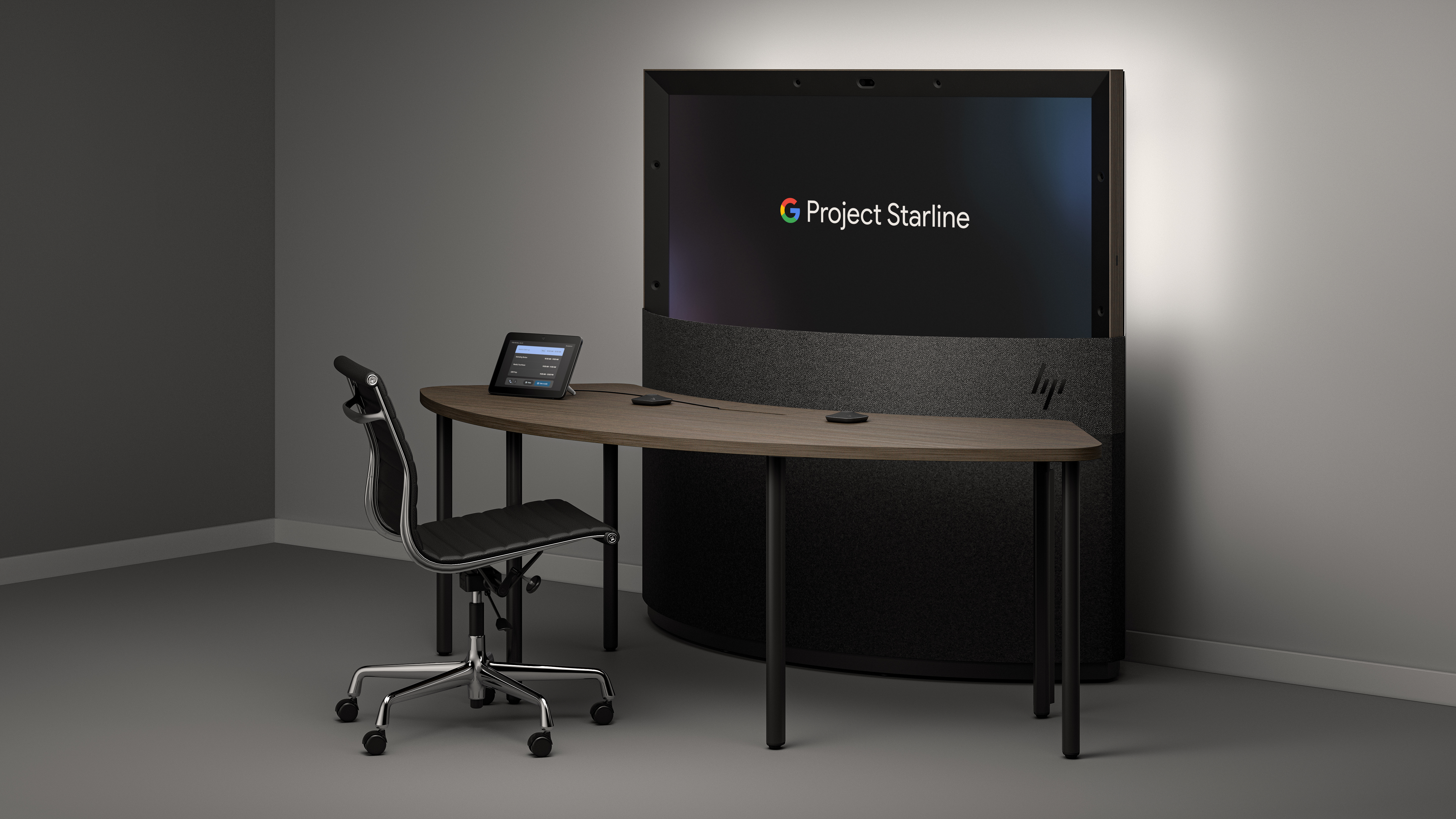A view of the upcoming Project Starline product from HP, with a display that says “Project Starline”, a table and a chair.