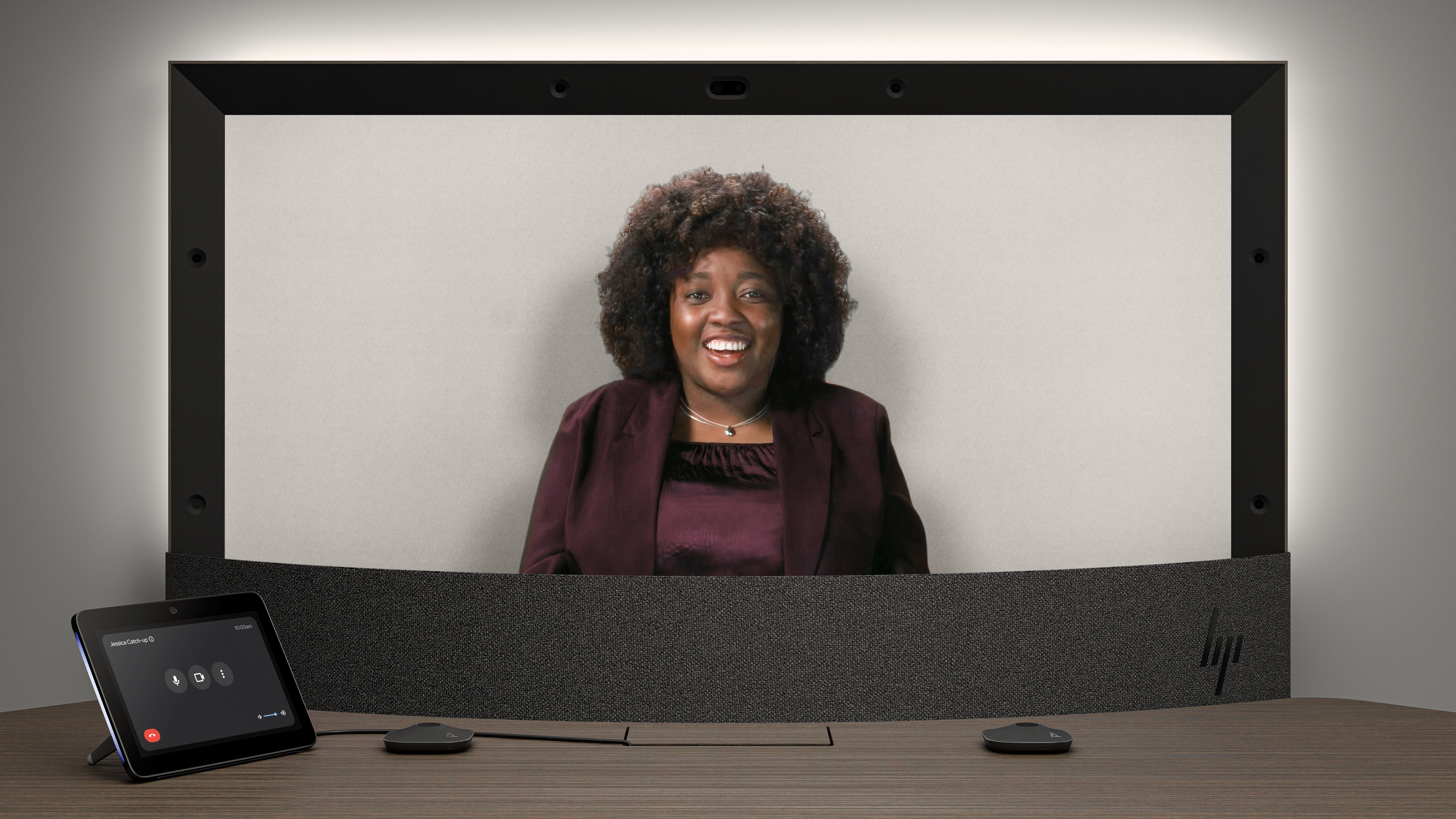 A view of the upcoming Project Starline product from HP, with a display showing a person, a table and a chair.