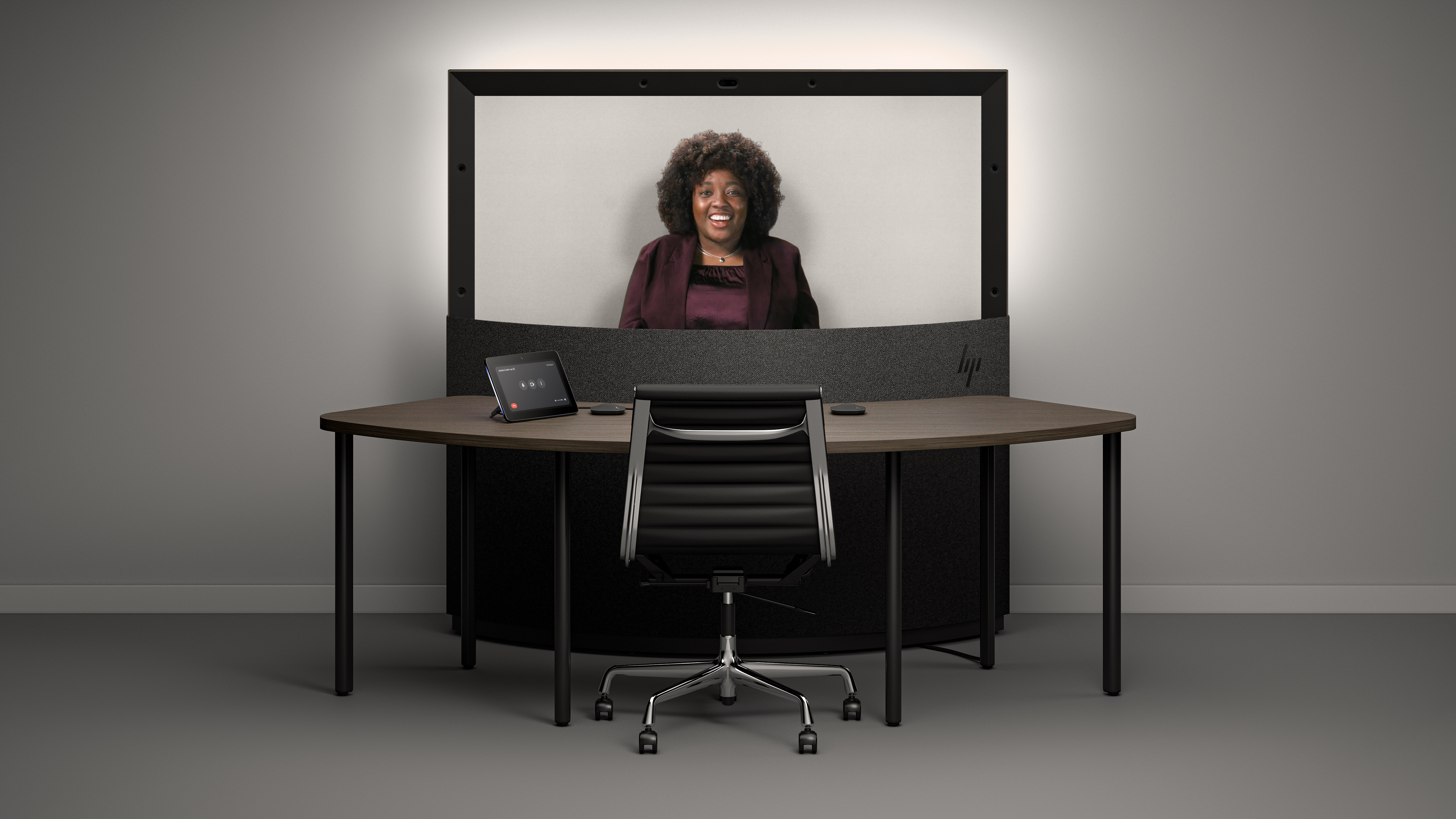 A view of the upcoming Project Starline product from HP, with a display that shows a person and a touch controller on a table.