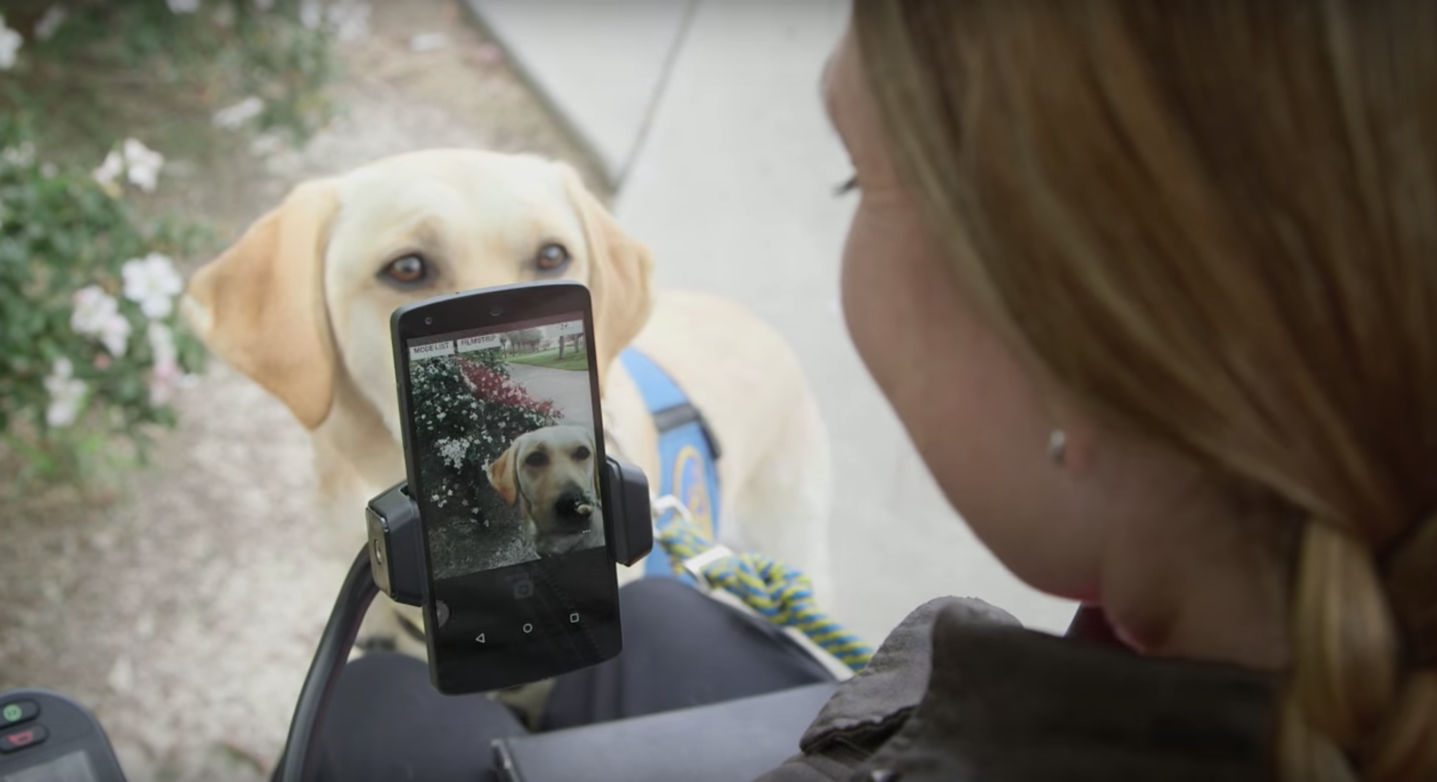 Woman using Voice Access to take a photo of her dog