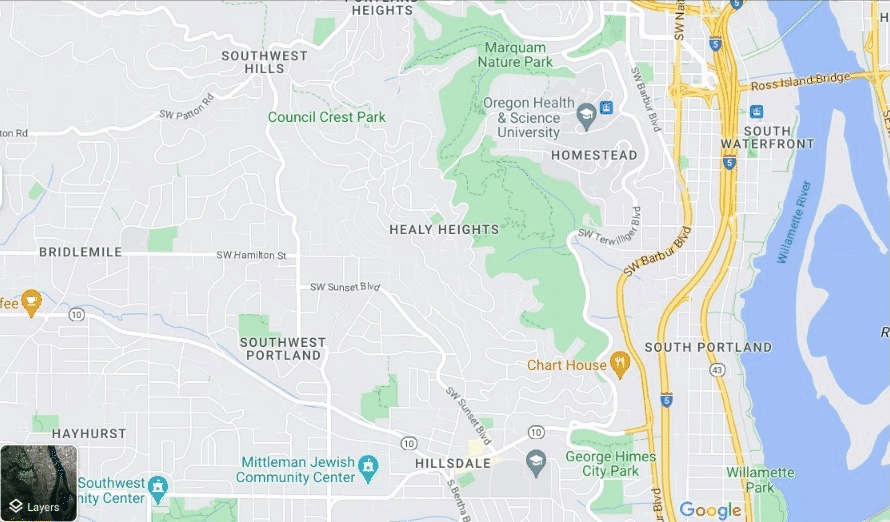 Animated GIF showing Google Maps in regular mode where you see streets and other landmarks. The cursor navigates to the bottom left-hand corner and chooses the satellite view, changing everything to show more natural details like trees and trails. The cursor then zooms in on a green area, zooming in more to reveal trail landmarks, including one trails called "Flicker Trail" inside of the green area in the city.