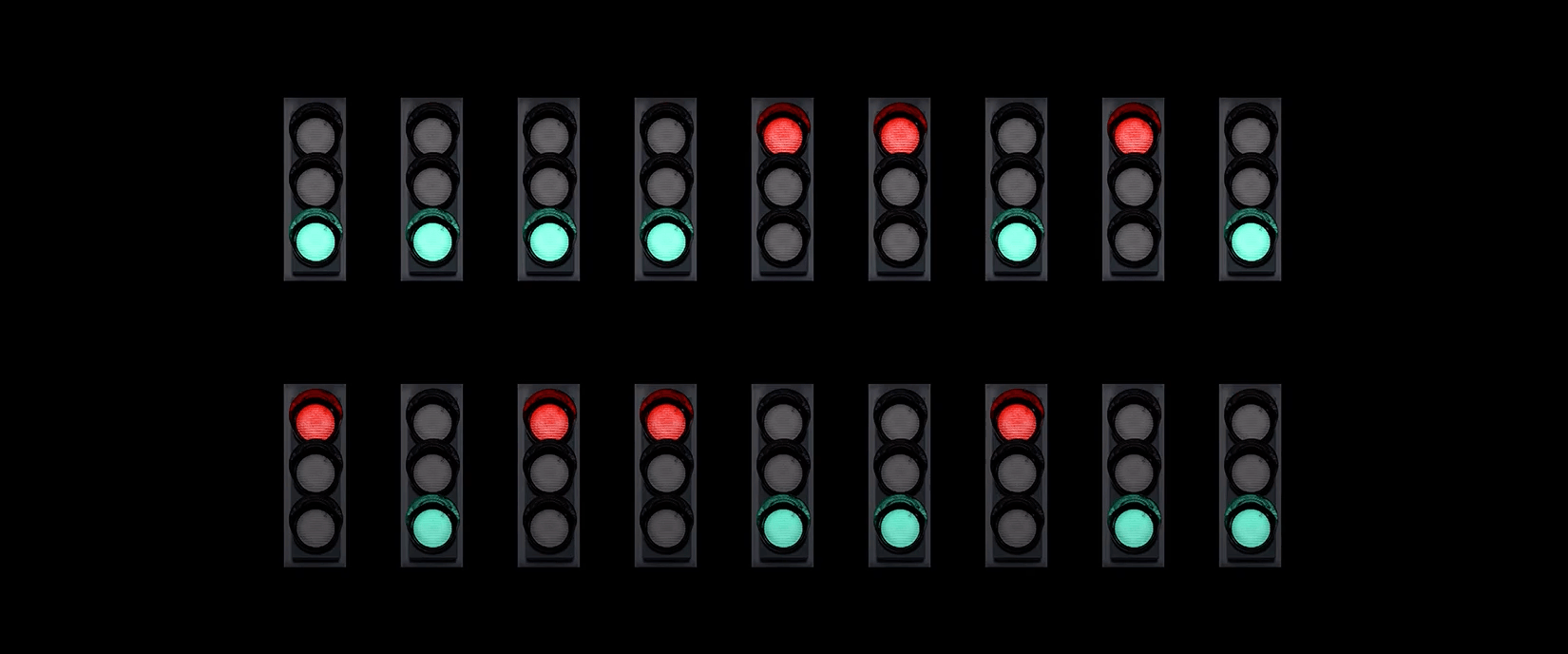 Animated gif of two rows of traffic lights. The lights are intermittently switching from green to red.