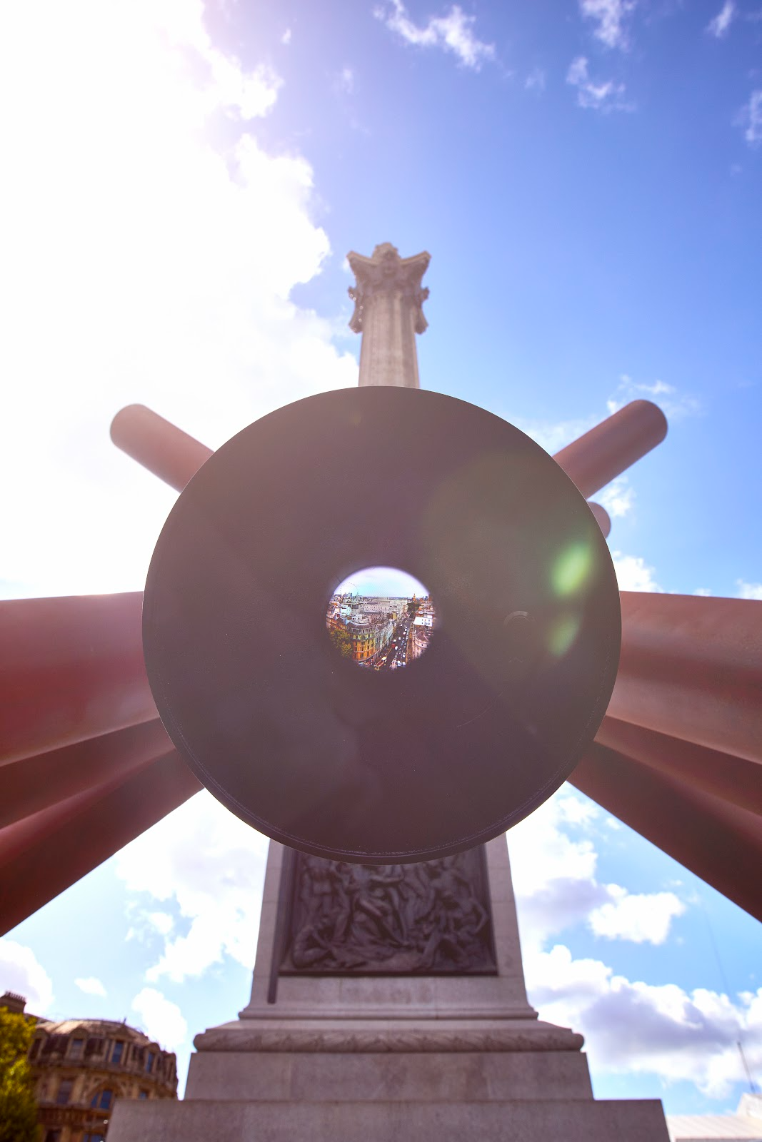 View of the portal in the sculpture showing the view of London from Nelson’s column with Nelson's column in the background.