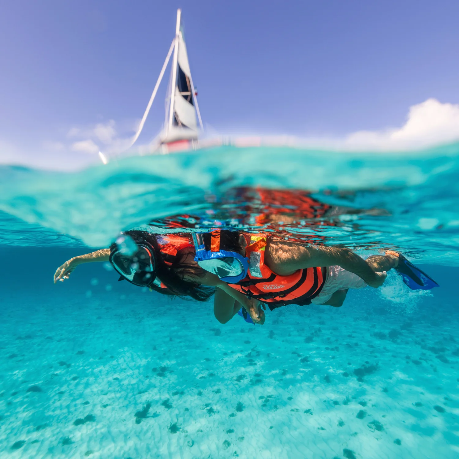 Couple snorkeling at sea during a catamaran tour to Isla Mujeres