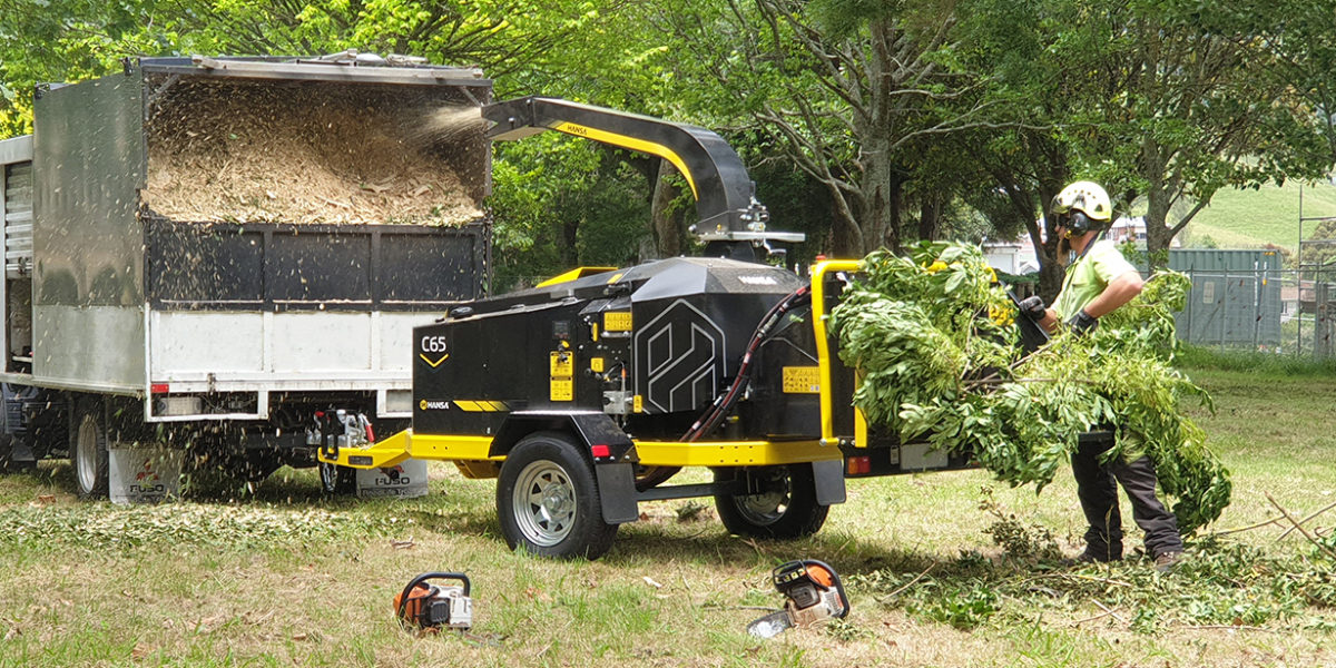 Commercial wood chipper attached to truck