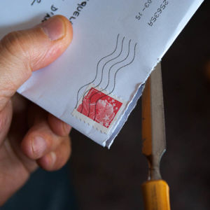 Person opening a letter