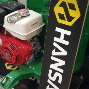 Close up view of Hansa branding on the side panel of a commercial wood chipper