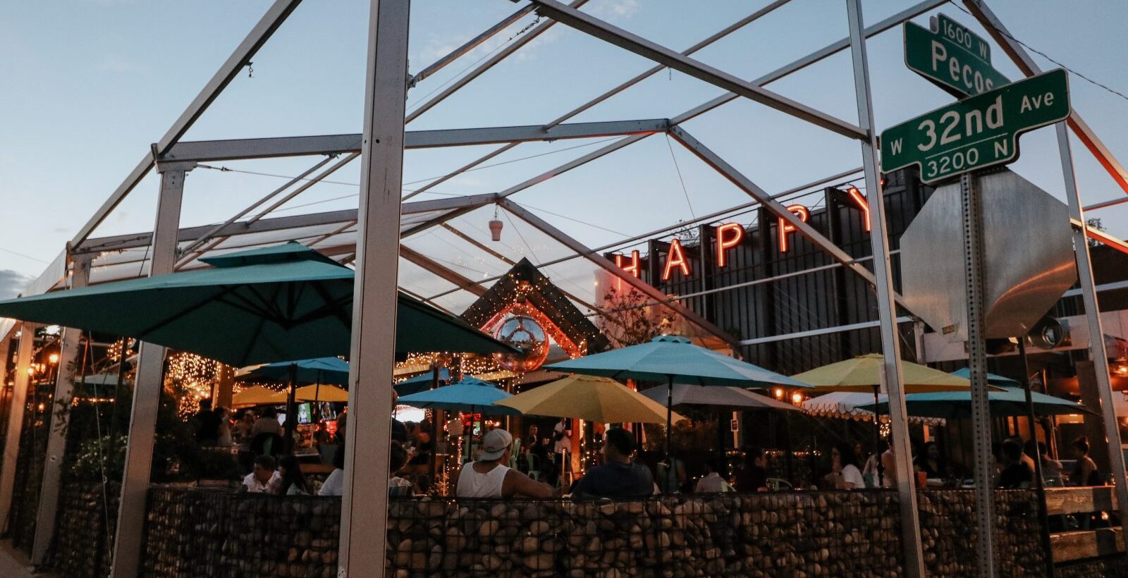 patio at happy camper Denver during sunset with 