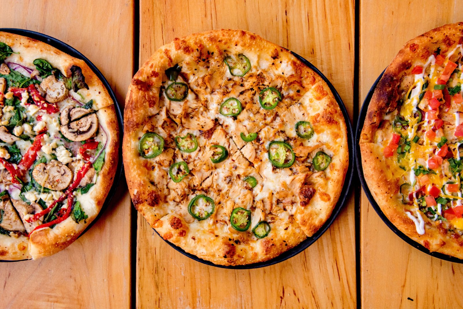 three of our signature pizzas