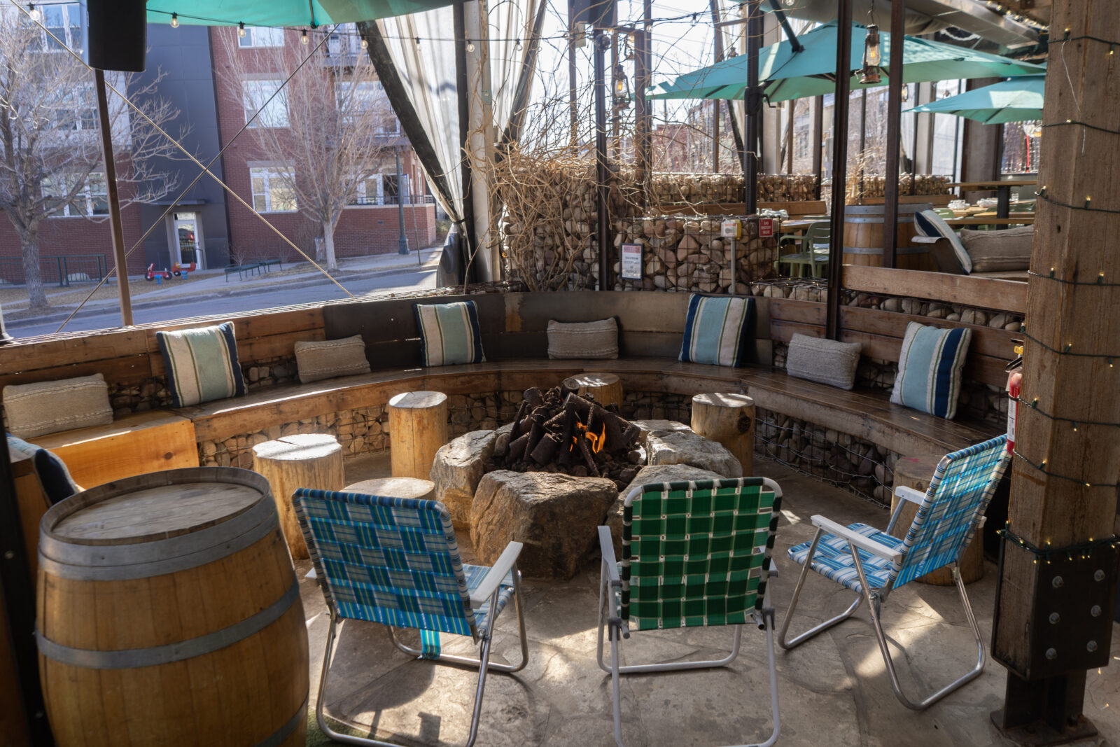 slide 2 of 3 - Firepit seating on a patio