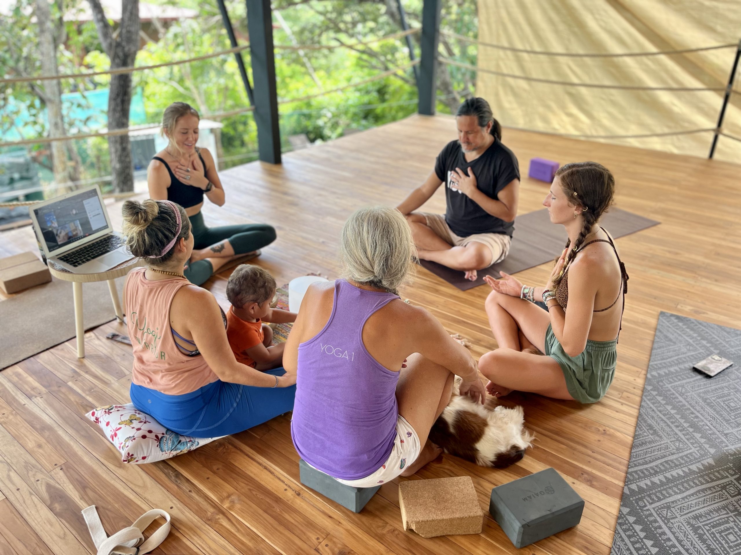 Hands channeling Reiki energy during a healing session at Hari OM training.
