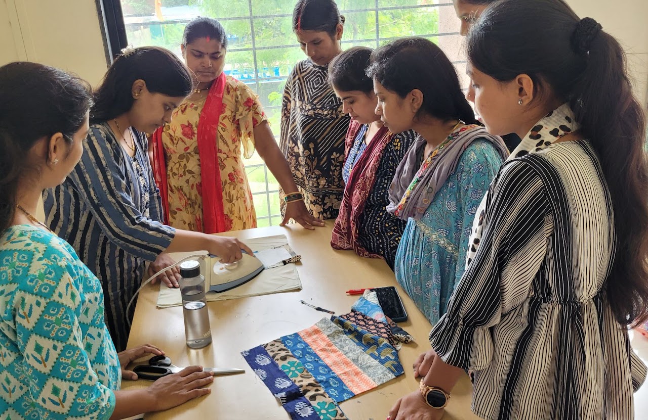 Women working on fabric upcycling with sewing machines
