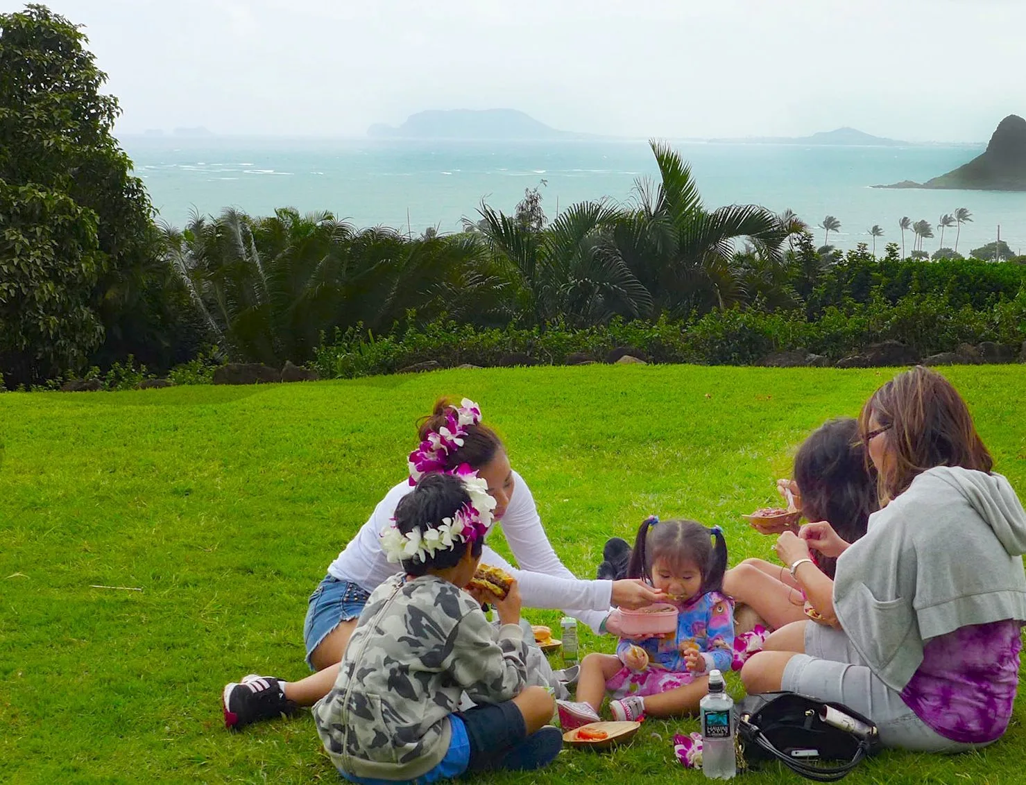 A family picnics at Kualoa Ranch