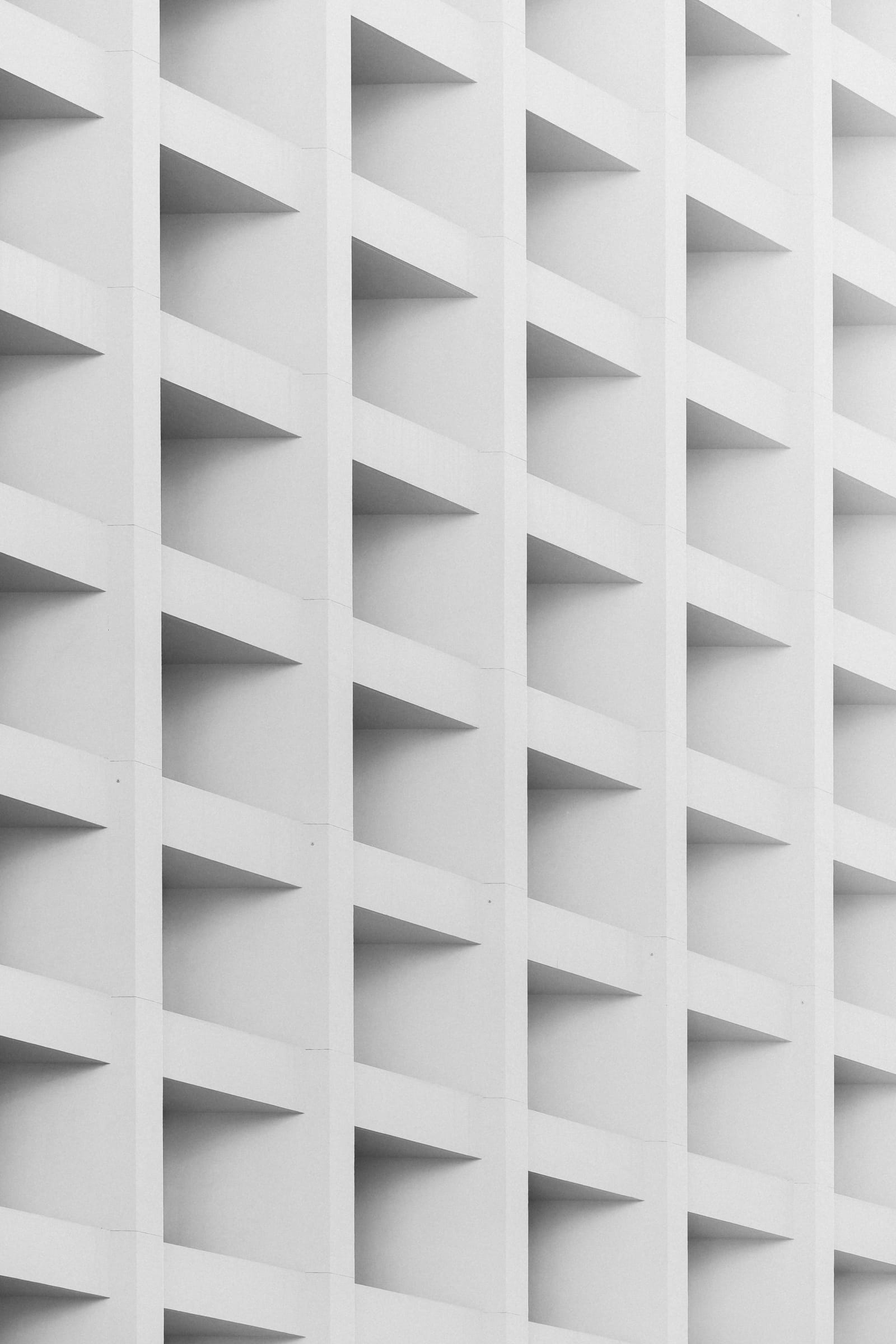 Modern building façade with geometric glass panels