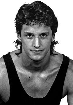 Black and white headshot of Rico Chiapparelli in a wrestling singlet