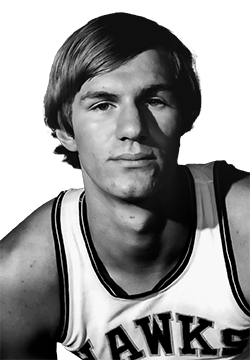 Black and white headshot of Kevin Kunnert wearing an Iowa basketball jersey