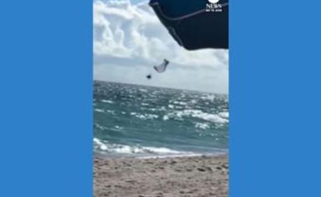 WATCH: Paraglider survives nearly 500-foot fall into ocean