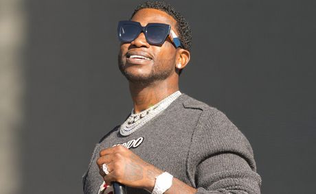 Gucci Mane in a HOKA ad with NBA ref twin