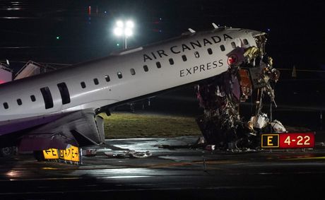 Air Canada plane collides with fire truck at LaGuardia, killing two and injuring dozens