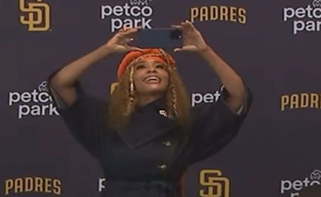 Kwanza Jones photographs reporters at press conference introducing her as the San Diego Padres owner [VIDEO]