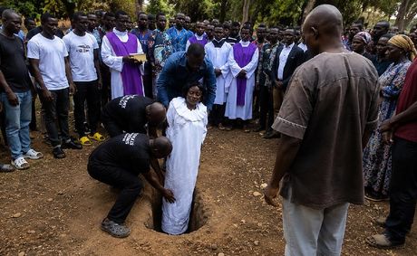 Video Shows Woman Buried Completely Upright in Striking Funeral Rite | WATCH