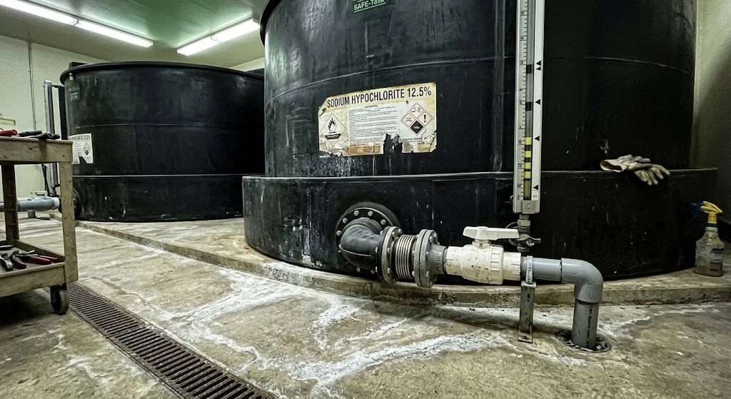 Poly Processing SAFE-Tank installed in the field, labeled for sodium hypochlorite 12.5% service