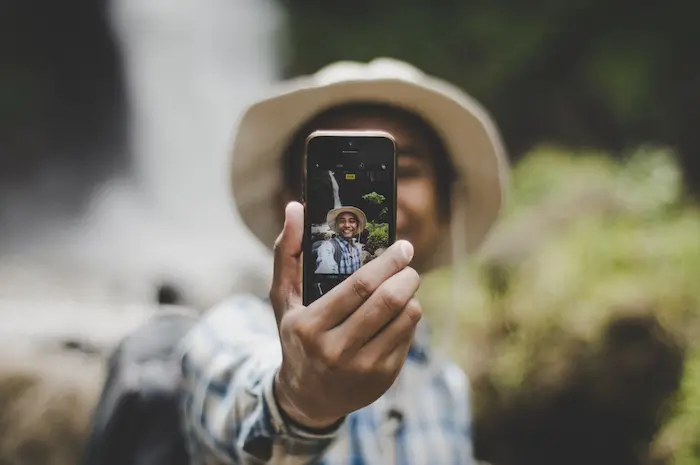 Image of a man taking a selfie