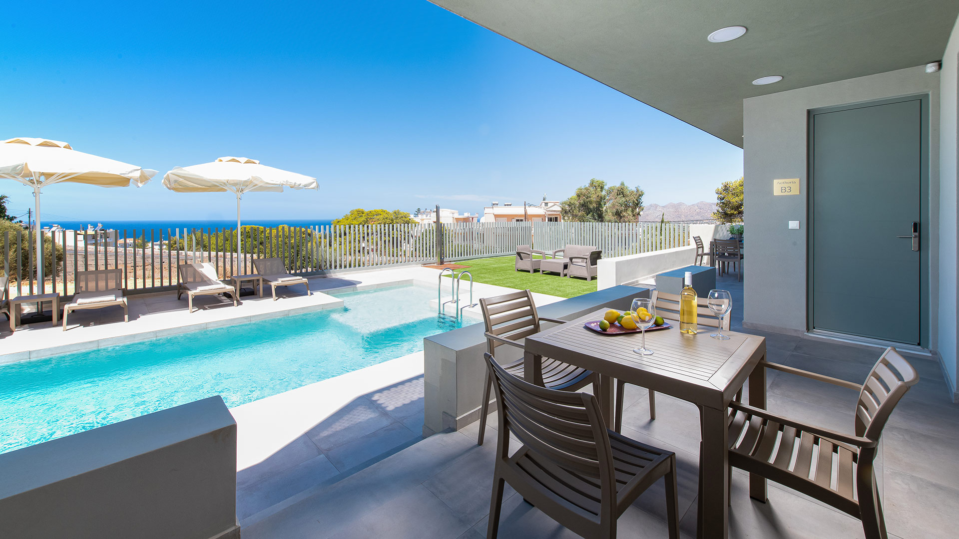 Table at balcony with pool view