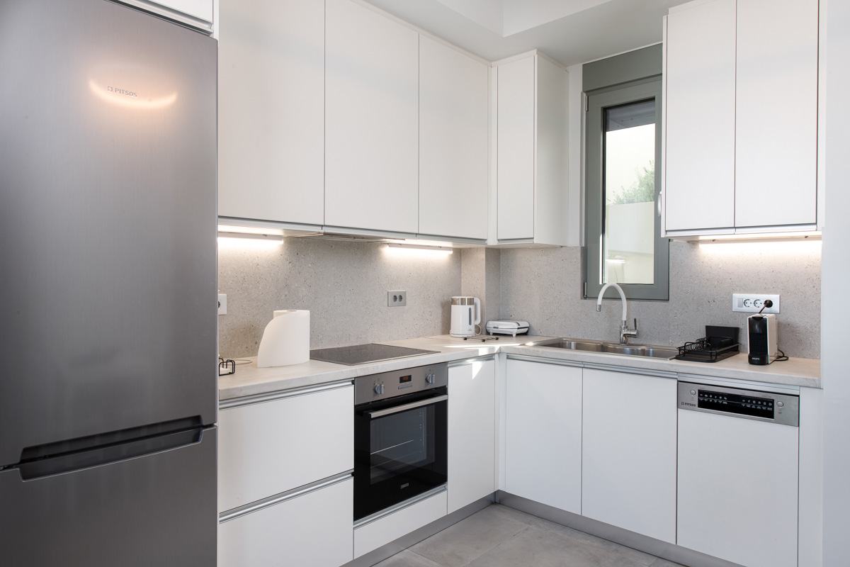 Fully equipped kitchen in white colour