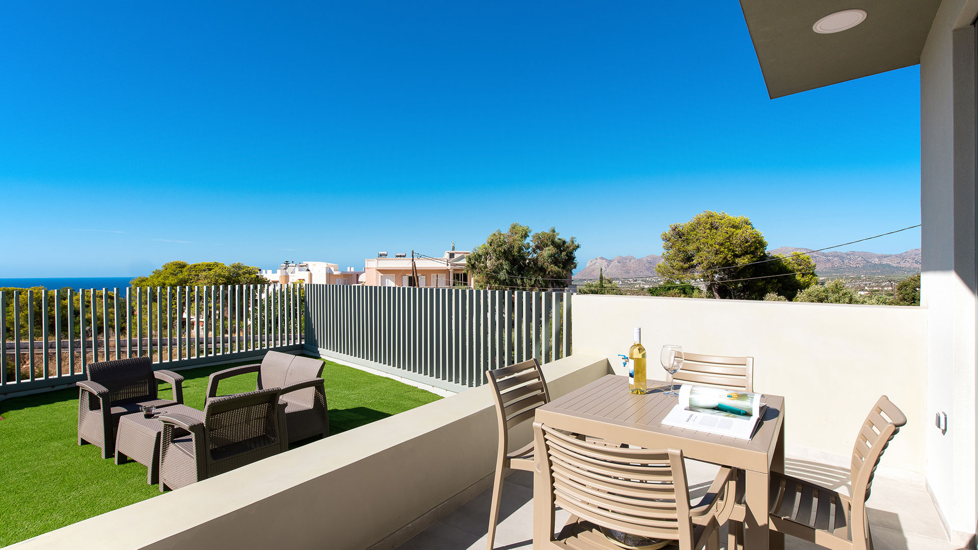 Balcony with table and outdoor seating area