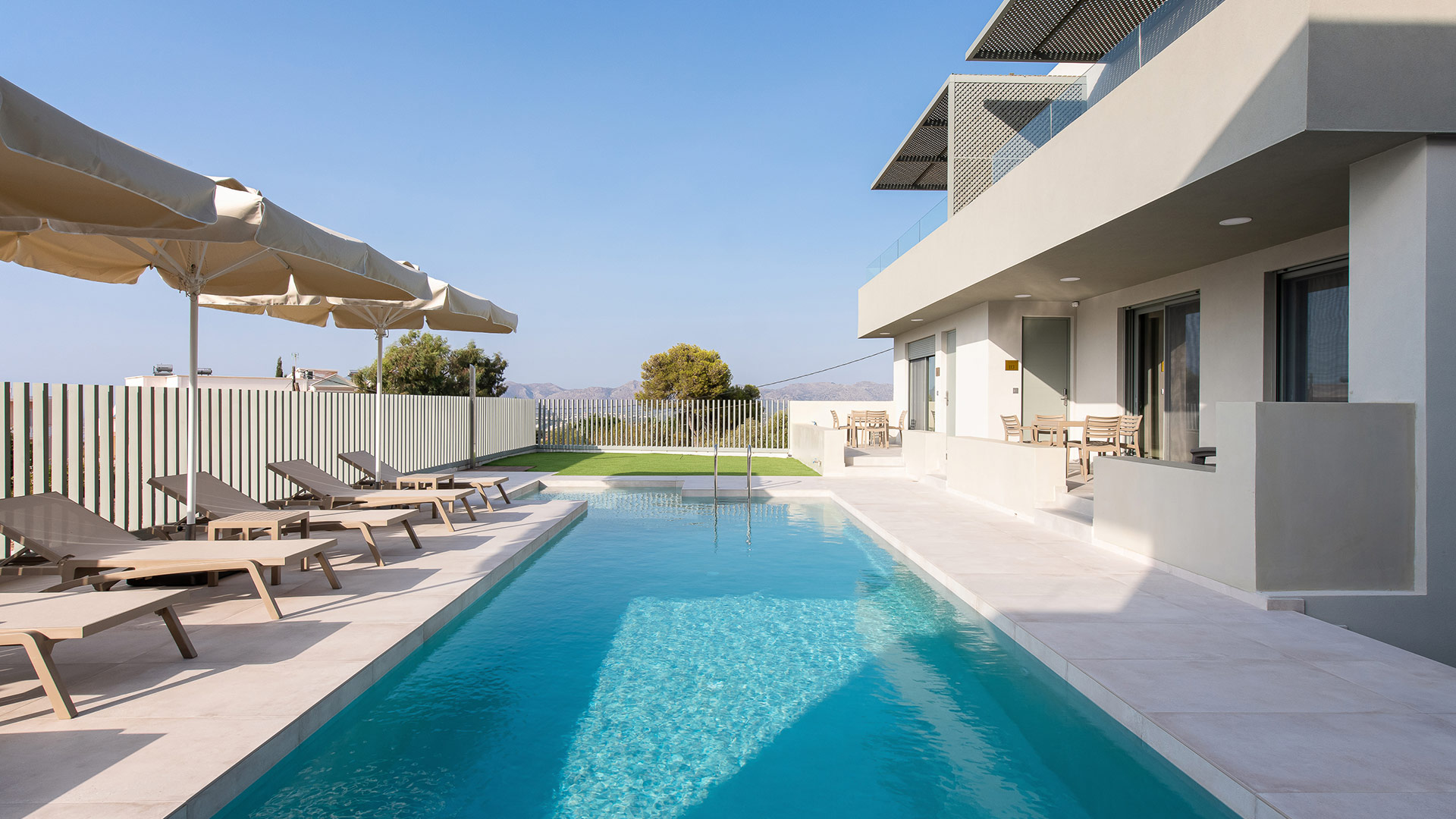 Outdoor pool with sunbeds