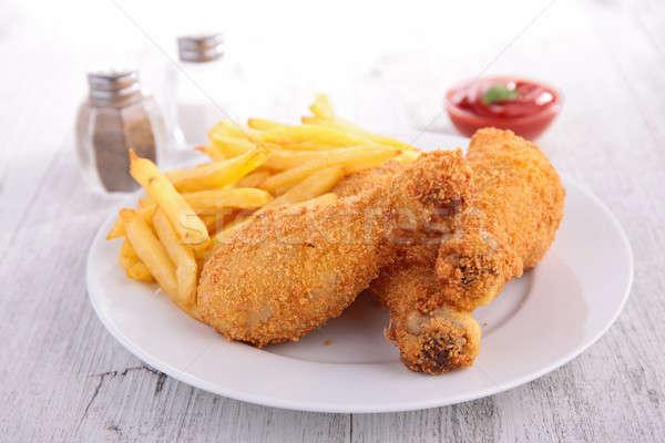 Crispy chicken legs with chips