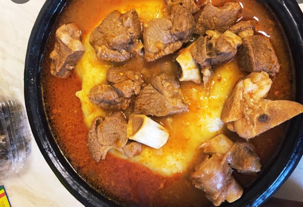 Fufu with groundnut soup and  cow meat