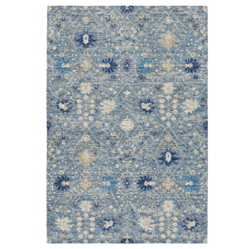 RLight blue patterned area rug with a Moroccan or medallion design and accents of cream and darker blue, marked at a holiday sale price of $499 inside a peppermint wreath graphic.