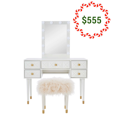 White Hollywood vanity makeup table and stool set with lighted mirror, gold-tipped legs, and decorative drawers. On sale for $555.