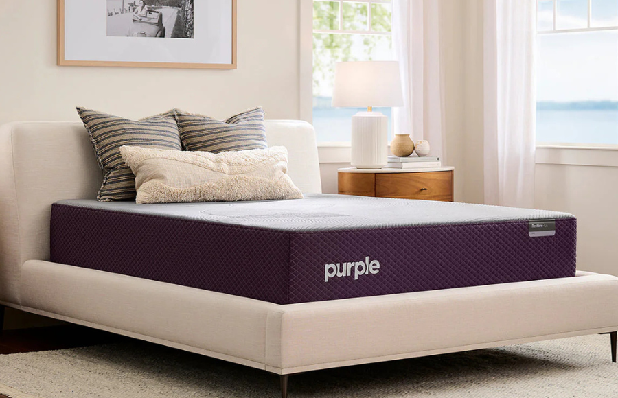 Unique log cabin-style bunk bed with a grey peaked roof and two windows. Features a bottom bed enclosed like a playhouse and a top bunk accessible by ladder. Perfect kids' bed for imaginative play, maximizing small spaces. Includes built-in shelves shaped like houses. Ideal for children's bedrooms