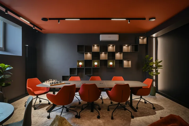 Coworking room with meeting tables and lounge seating