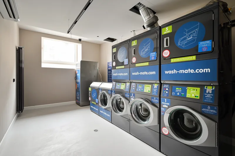 Residents’ laundry room with washers and dryers