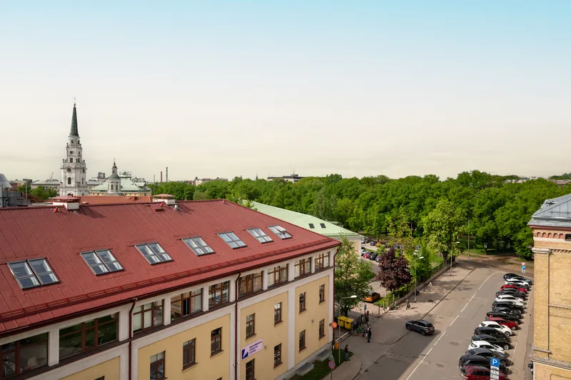 View from HIDE over the rooftops of central Riga towards a park and a church spire