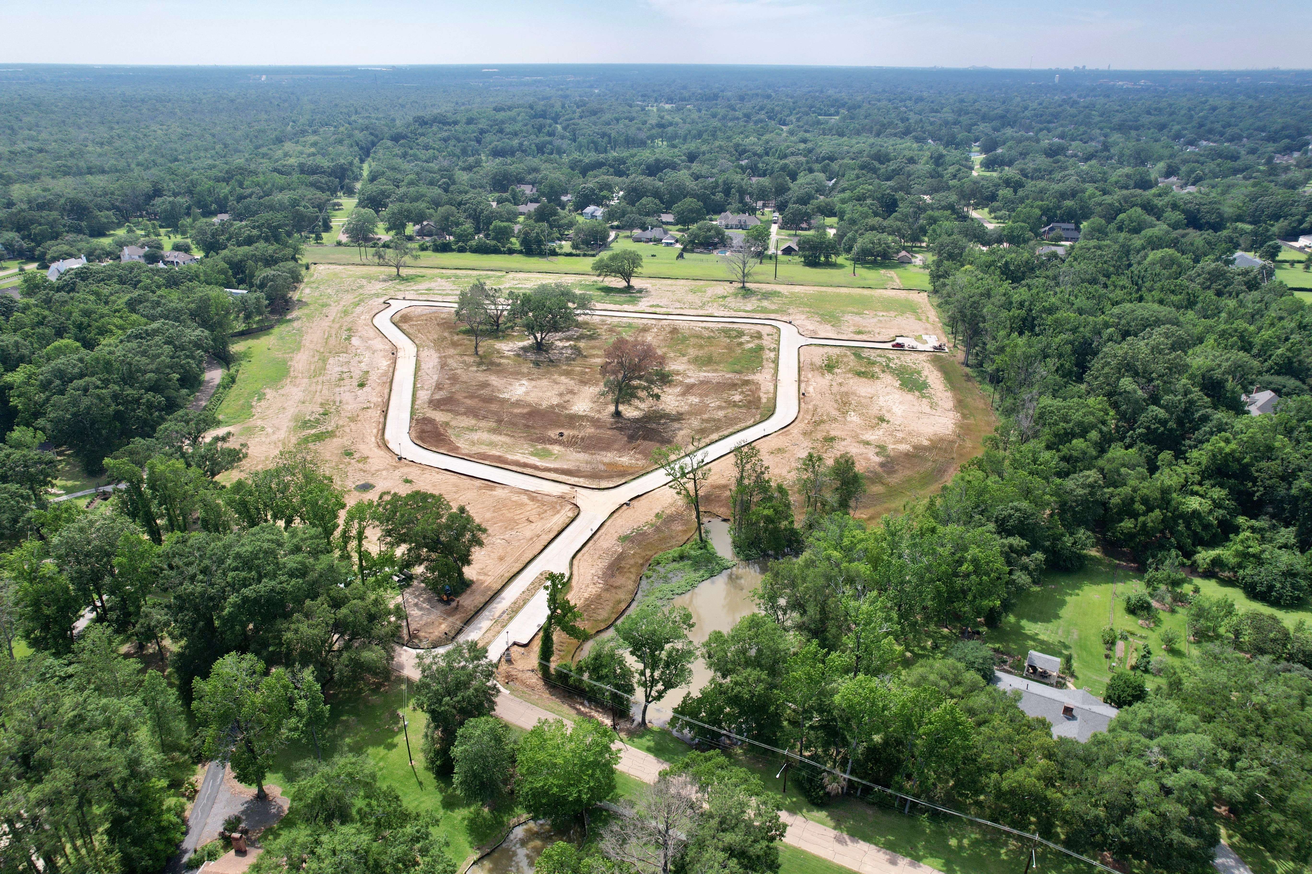Aerial over the central pond and street layout at Highlake