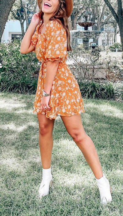 A floral mini dress is a perfect solution on days when you can't decide what to wear. Pull it all together with minimal effort and maximum results by pairing it with pointed block heel boots, a summer hat, and a beautiful smile.