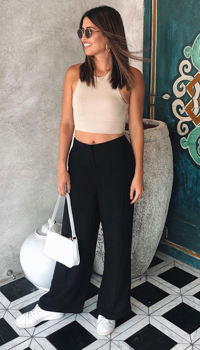 Ribbed tank top and flare pants combo for summer vacation outfits. 23 Summer Vacation Outfits To Make Your Next Trip Stylish