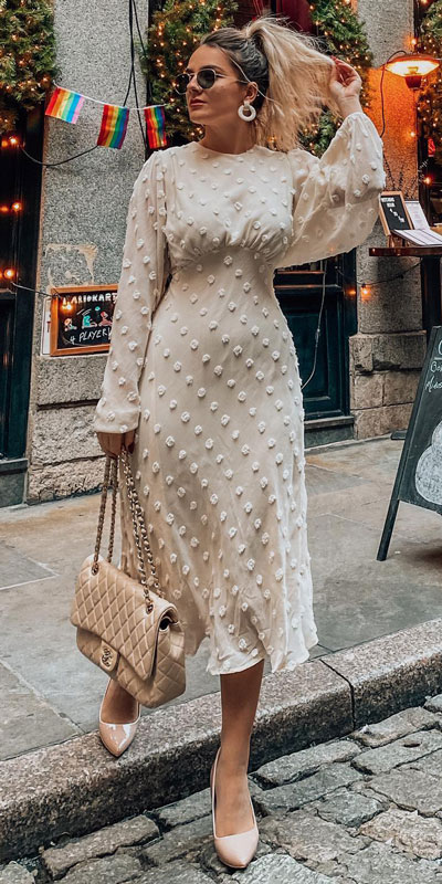 Light, comfortable, and roomy but not sloppy. You can’t say enough about this adorable cream cotton candy sheer maxi dress! Dolled up with a Chanel flap bag and nude pump for a complete look.