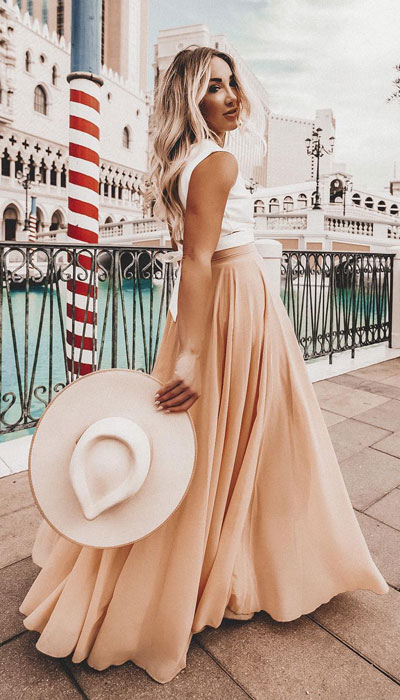 This look can be your entire vibe for all summer long. A timeless chiffon maxi skirt combined with a sleeveless tank top is such a mood. This look is perfect from a beach to a BBQ and everywhere in between.