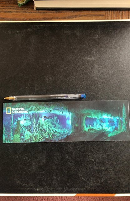 National Geographic bookmark with cave diving scene